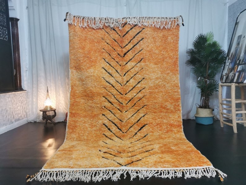 Handmade Moroccan Berber Wool Area Rug 10 x 5 Feet: Handmade Moroccan Berber Wool Area Rug 10 x 5 Feet Introducing a stunning, authentic handmade Moroccan Berber wool area rug, beautifully crafted by local Berber women weavers in the Atlas Mountains. T