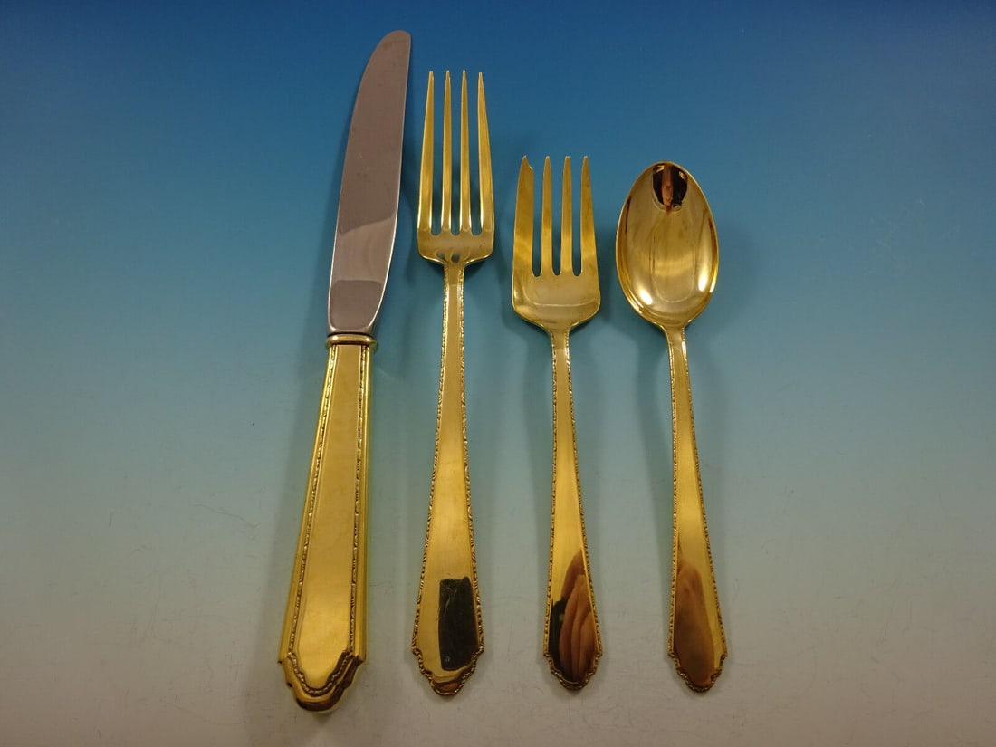 Lunt William & Mary Vermeil Sterling Silver 4-Piece Place Setting: Lunt William & Mary Vermeil Sterling Silver 4-Piece Place Setting Elevate your dining experience with this exquisite 4-piece place setting in the William & Mary pattern by Lunt. Crafted from high-qual