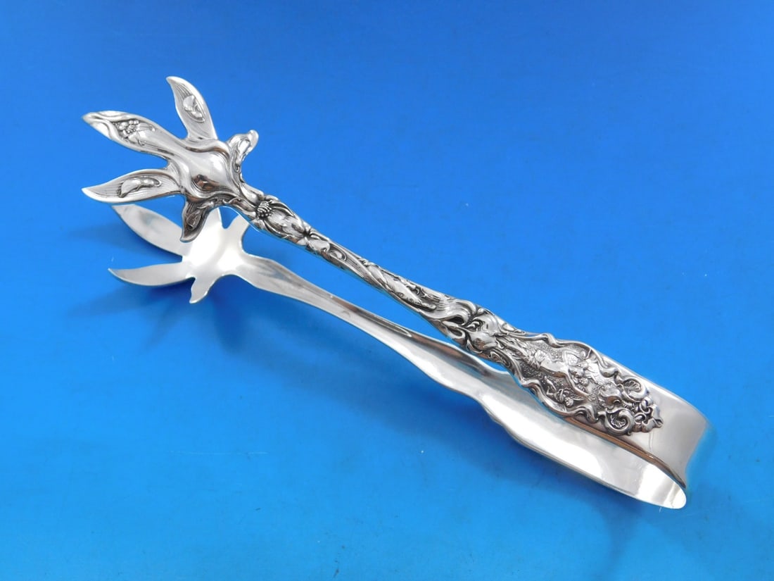 Wallace Irian Sterling Silver Ice Tong 6 3/4 Inch Serving Piece: Wallace Irian Sterling Silver Ice Tong 6 3/4 Inch Serving Piece Introducing the exquisite Irian ice tongs by Wallace, crafted from high-quality sterling silver. This elegant serving piece measures 6 3