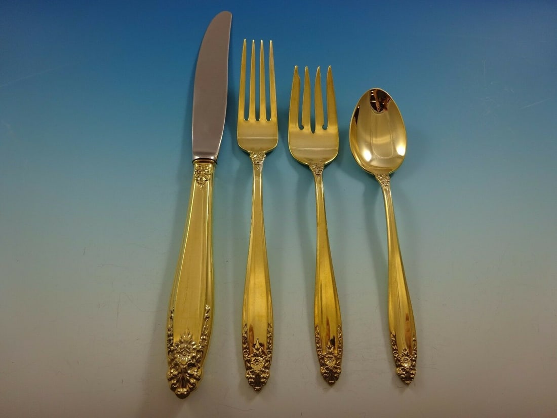 International Prelude Vermeil Sterling Silver 4-Piece Place Setting: International Prelude Vermeil Sterling Silver 4-Piece Place Setting This exquisite 4-piece place setting features the Prelude Vermeil pattern by International Sterling. Crafted from sterling silver an