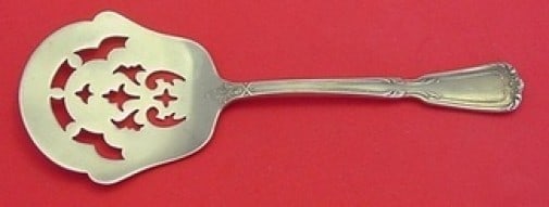 Reed & Barton Chambord Sterling Silver Pierced Cucumber Server 6 3 8: Reed & Barton Chambord Sterling Silver Pierced Cucumber Server 6 3 8 This is a Reed & Barton sterling silver cucumber server in the Chambord pattern, featuring a decorative pierced design. Measuring 6