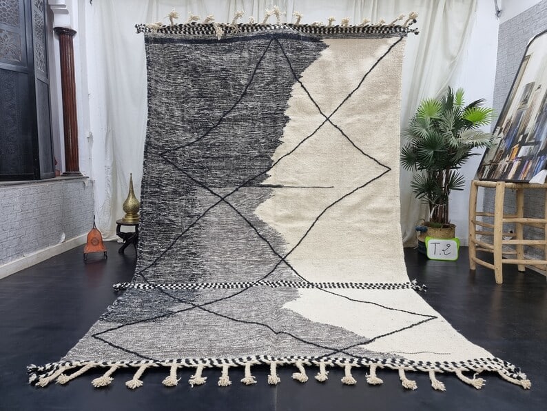 Handmade Moroccan Berber Wool Area Rug 9.84 x 6.56 Feet: Handmade Moroccan Berber Wool Area Rug 9.84 x 6.56 Feet Enhance your living space with this stunning handmade Moroccan Berber wool area rug, featuring an elegant grey and white color scheme complement