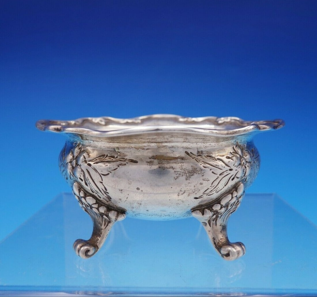 Dominick & Haff Sterling Silver Footed Salt Cellar with Floral Chasing: Dominick & Haff Sterling Silver Footed Salt Cellar with Floral Chasing This exquisite sterling silver salt dip, also known as a salt cellar, is crafted by Dominick & Haff. It features a charming foote