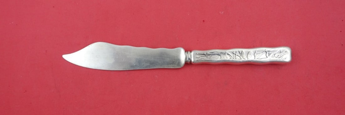 Tiffany & Co. Lap Over Edge Sterling Silver Fish Knife 7 7/8": Tiffany & Co. Lap Over Edge Sterling Silver Fish Knife 7 7/8" This exquisite fish knife, crafted by Tiffany & Co., showcases the elegant Lap Over Edge pattern. Made from high-quality sterling silver, 