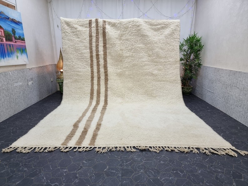 Authentic Handwoven Soft White Rug from Morocco 10 x 6.56 Feet: Authentic Handwoven Soft White Rug from Morocco 10 x 6.56 Feet Enhance your living space with this Elegant Soft White Rug, meticulously handwoven in the Atlas Mountains by skilled local Berber women w