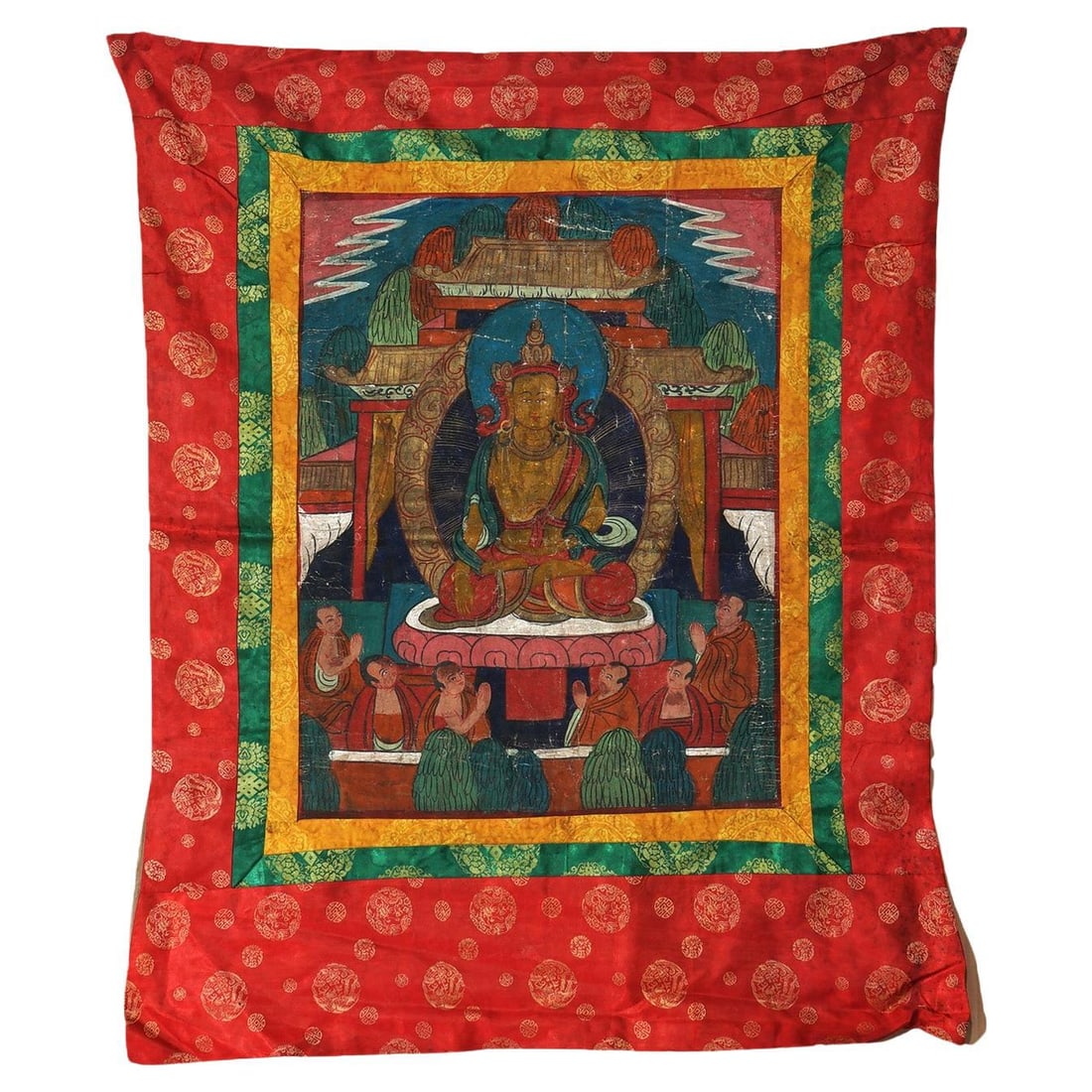 Hand Painted Tibetan Thangka on Silk and Canvas with Figures Circa 1920: Hand Painted Tibetan Thangka on Silk and Canvas with Figures Circa 1920 This antique Tibetan Thangka, crafted around 1920, is a traditional Buddhist artwork featuring meticulously hand-painted figures