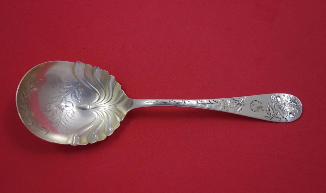 Towle Number 43 sterling silver preserve serving spoon gold washed 7 1/4: Towle Number 43 sterling silver preserve serving spoon gold washed 7 1/4 Towle Number 43 sterling silver preserve spoon with gold washed, bright-cut decoration. It is monogrammed, with monograms varyi