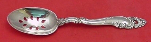 Gorham Decor Sterling Silver 9-Hole Pierced Serving Spoon 8.5": Gorham Decor Sterling Silver 9-Hole Pierced Serving Spoon 8.5" This exquisite slotted serving spoon from Gorham is crafted from high-quality sterling silver, featuring a unique 9-hole design. Measurin