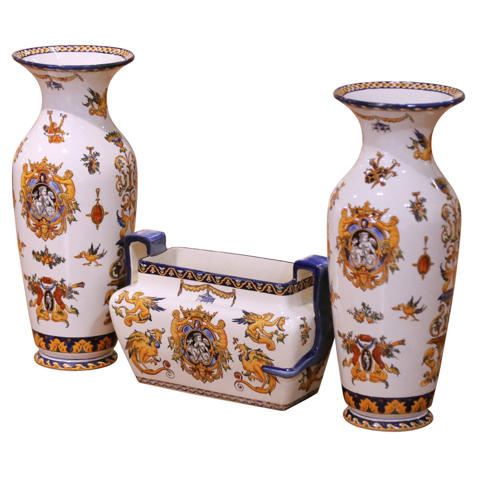 Gien Renaissance Revival French Faience Garniture Set With Vases and Jardiniere: Gien Renaissance Revival French Faience Garniture Set With Vases and Jardiniere This late 19th century French Gien Faience garniture set, crafted circa 1880, features three pieces: a pair of tall balu