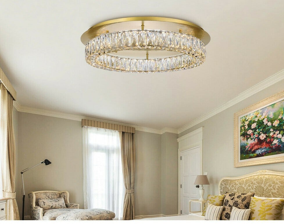 Monroe Goldish Crystal LED Flush Mount Chandelier 25.6 Inch: Monroe Goldish Crystal LED Flush Mount Chandelier 25.6 Inch This modern flush mount chandelier features a round design with a gold finish and royal cut clear crystal accents. It is equipped with integ