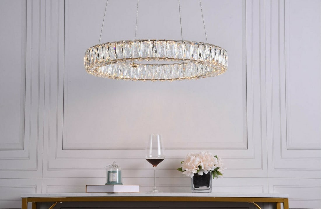Monroe LED Crystal Ring Chandelier 23 in Gold: Monroe LED Crystal Ring Chandelier 23 in Gold Modern goldish crystal chandelier with a round shade shape and integrated LED lighting. It is hardwired for indoor installation and features upward and do