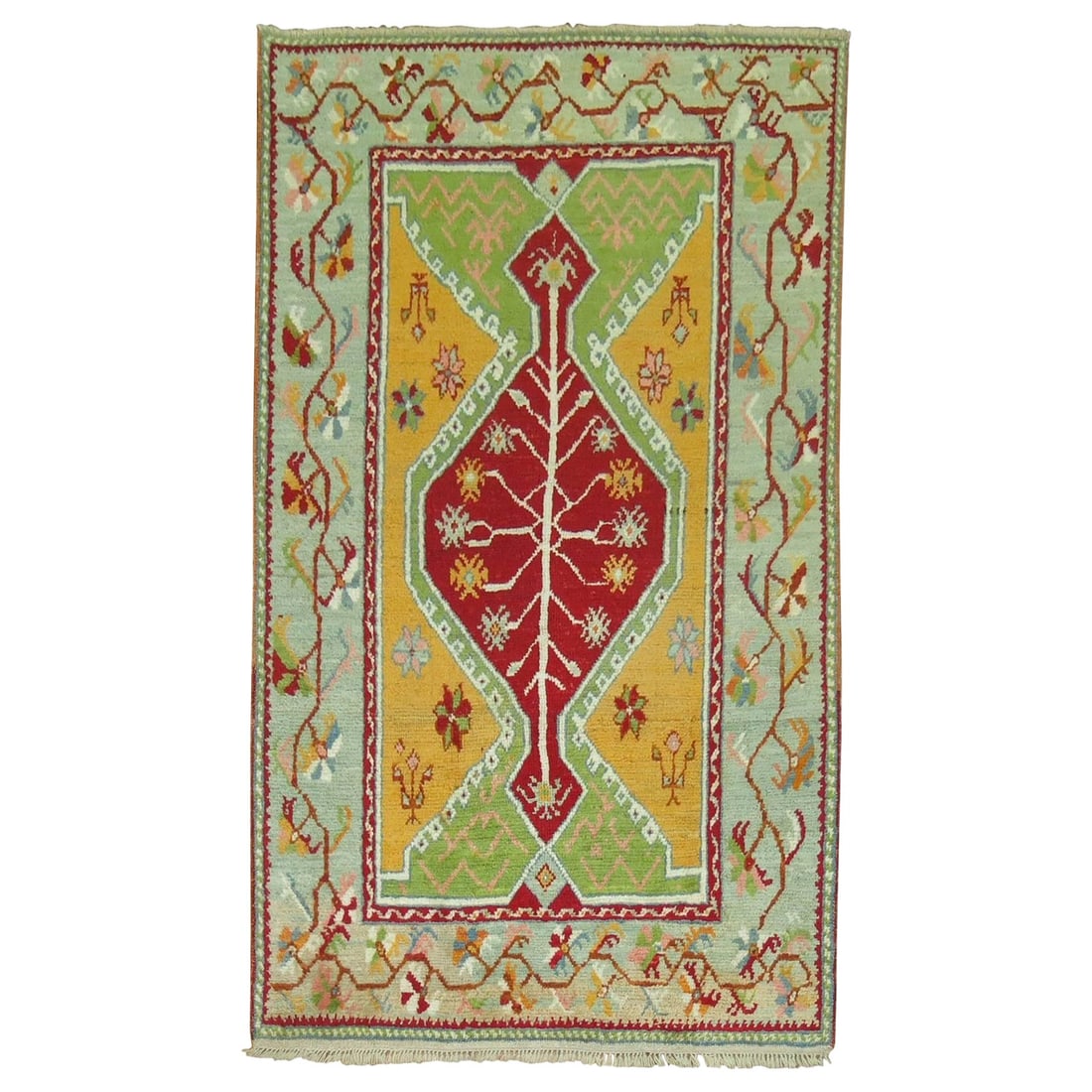 Vibrant Antique Turkish Ghiordes Hand-Knotted Wool Rug 3'9'' x 6': Vibrant Antique Turkish Ghiordes Hand-Knotted Wool Rug 3'9'' x 6' This Antique Turkish Ghiordes Rug showcases a stunning Arts and Crafts style, beautifully crafted from hand-knotted wool. The rug feat
