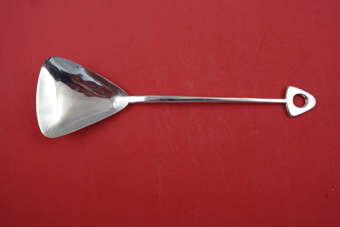 DJL English Sterling Estate Triangular Preserve Spoon 6 3/4": DJL English Sterling Estate Triangular Preserve Spoon 6 3/4" This exquisite preserve spoon is crafted from sterling silver and features a distinctive triangular shape. Designed by DJL, it showcases a 
