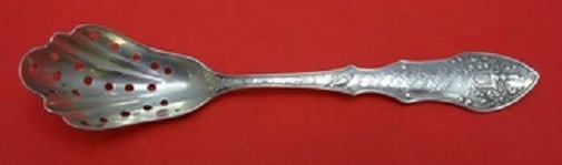 Shiebler Linnet Sterling Silver Pierced Olive Spoon 5 1/4": Shiebler Linnet Sterling Silver Pierced Olive Spoon 5 1/4" This exquisite serving spoon features the elegant Linnet pattern by Shiebler, crafted from high-quality sterling silver. Measuring 5 1/4 inch