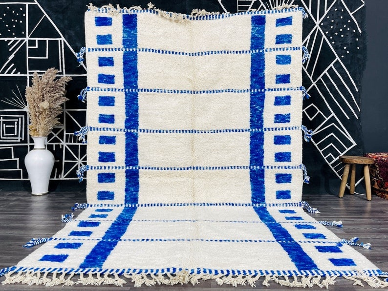 Authentic Handwoven White and Blue Rug from Morocco: Authentic Handwoven White and Blue Rug from Morocco Discover the beauty of this stunning authentic white and blue rug, handwoven in the Atlas Mountains by local Berber women weavers. Crafted using tra