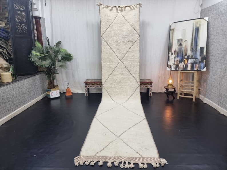 Authentic Soft White Moroccan Berber Runner Rug 2 x 10 Feet: Authentic Soft White Moroccan Berber Runner Rug 2 x 10 Feet Discover the beauty of this Authentic Soft White Handmade Moroccan Berber Runner Rug, featuring an elegant engraved geometric pattern. Skill