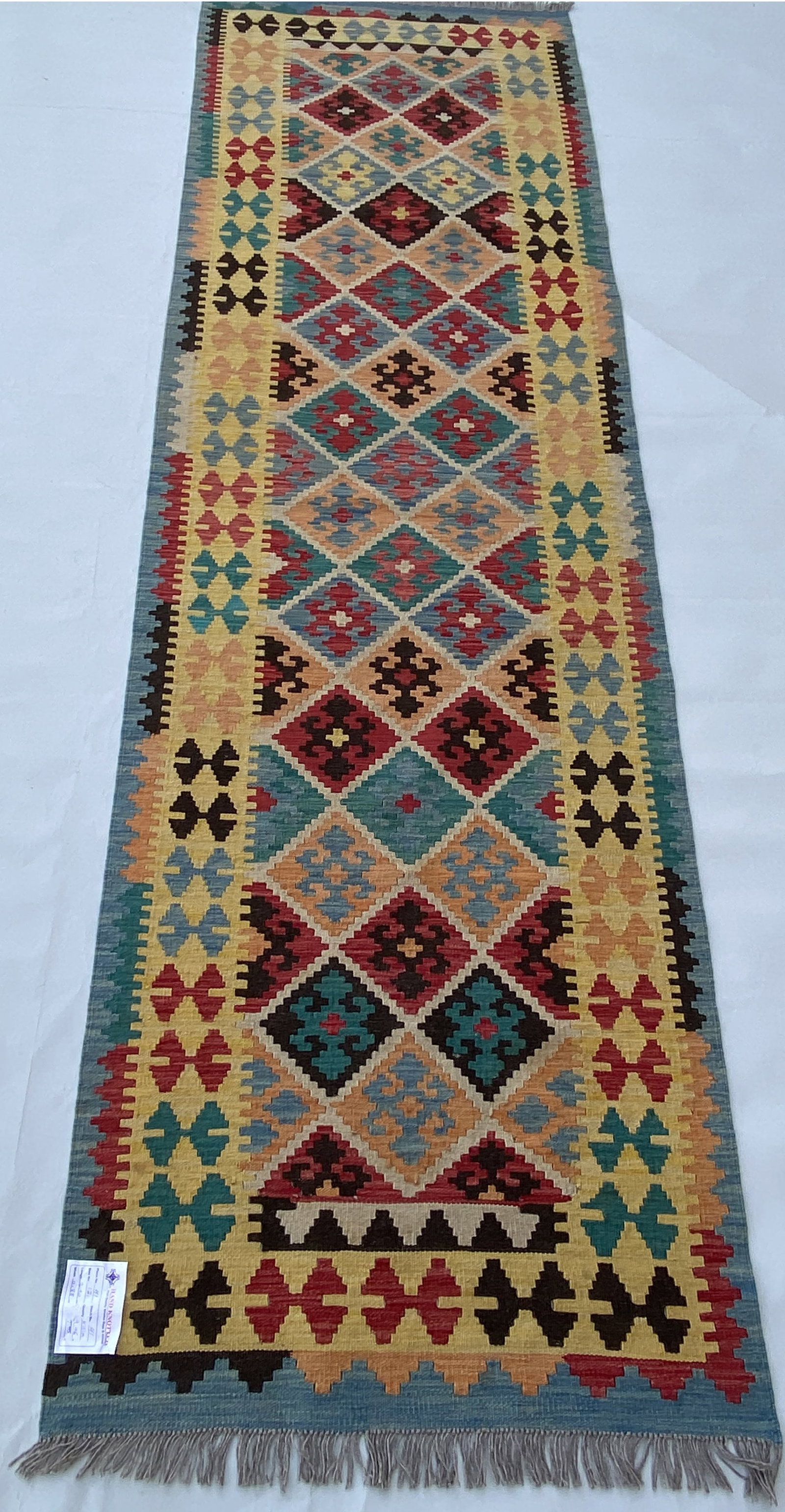 3' x 9' Multi-Color Ivory Handmade Kilim Rug from Afghanistan: 3' x 9' Multi-Color Ivory Handmade Kilim Rug from Afghanistan Free continental US Shipping Enhance your living space with this stunning 3' x 9' Multi-Color Ivory Handmade Kilim Rug from Afghanistan. E