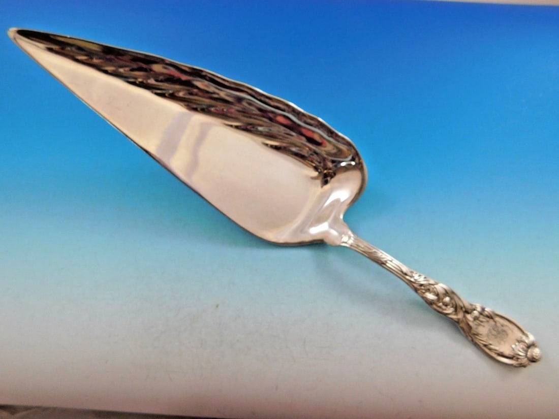 Tiffany & Co. Sterling Silver Crumber in Chrysanthemum Pattern 13 3/4 Inch Unusual Shape: Tiffany & Co. Sterling Silver Crumber in Chrysanthemum Pattern 13 3/4 Inch Unusual Shape This sterling silver crumber by Tiffany & Co. features the elegant Chrysanthemum pattern and was crafted in the