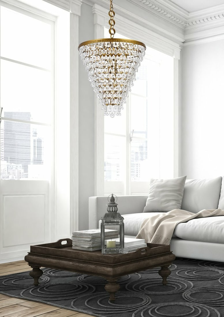 Living District Nordic 7 Light Brass Crystal Pendant Chandelier: Living District Nordic 7 Light Brass Crystal Pendant Chandelier This modern Nordic-style chandelier features a combination of brass color and clear glass crystals, creating an elegant lighting