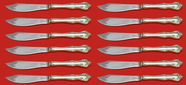 Towle Debussy 12 Piece Sterling Silver Steak Knives 8 1/4: Towle Debussy 12 Piece Sterling Silver Steak Knives 8 1/4 This is a set of twelve custom steak knives in the Debussy pattern by Towle. Each knife features a sterling silver hollow handle and a stainle