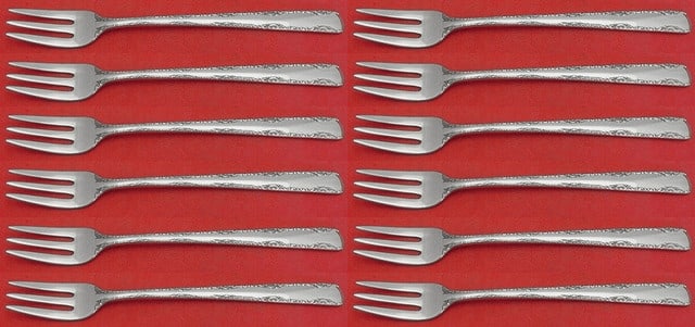 Gorham Camellia Sterling Silver Cocktail Fork Set 12 Pieces 5 5/8": Gorham Camellia Sterling Silver Cocktail Fork Set 12 Pieces 5 5/8" Enhance your dining experience with this elegant 12-piece set of cocktail forks from the renowned Gorham brand. Crafted from high-qua