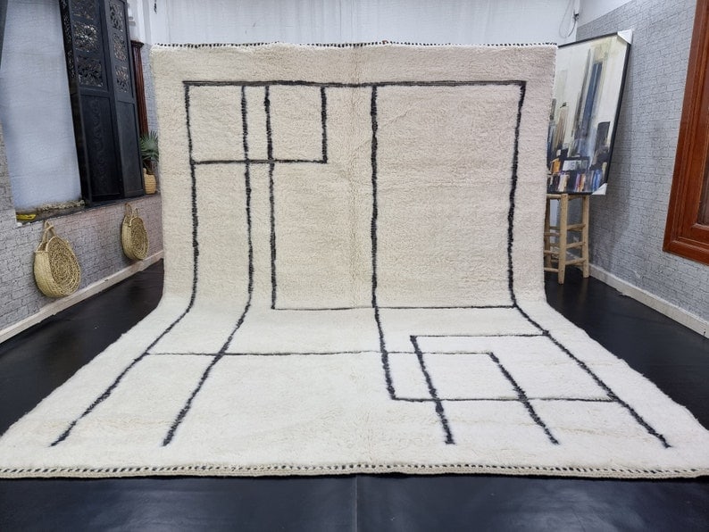 Luxury White Handwoven Rug with Black Pattern 10 x 6.56 ft: Luxury White Handwoven Rug with Black Pattern 10 x 6.56 ft Experience the elegance of this Luxury White Engraved Rug, crafted authentically by local Berber women weavers in the Atlas Mountains. This s
