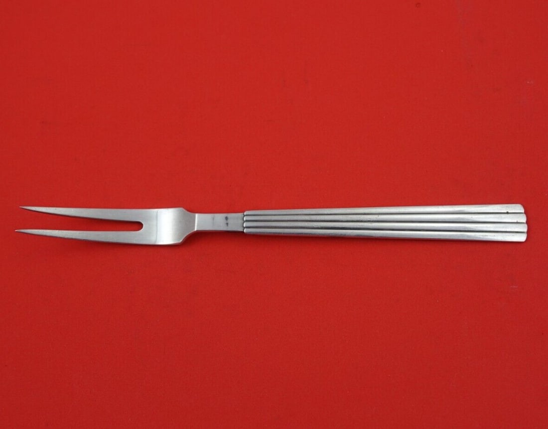 Georg Jensen Bernadotte Sterling Silver 2-Tine Cold Meat Fork 8 1/4": Georg Jensen Bernadotte Sterling Silver 2-Tine Cold Meat Fork 8 1/4" This exquisite 2-tine cold meat fork is part of the Bernadotte pattern by Georg Jensen, crafted from sterling silver. Measuring 8 1