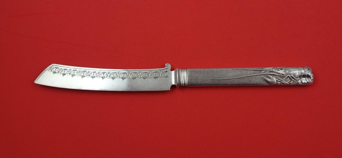 Aesthetic Sterling Silver Tea Knife 8 inch Oriental Lobster Motif: Aesthetic Sterling Silver Tea Knife 8 inch Oriental Lobster Motif This exquisite 8" tea knife showcases a remarkable Aesthetic design, featuring a sterling silver hollow handle adorned with an orienta