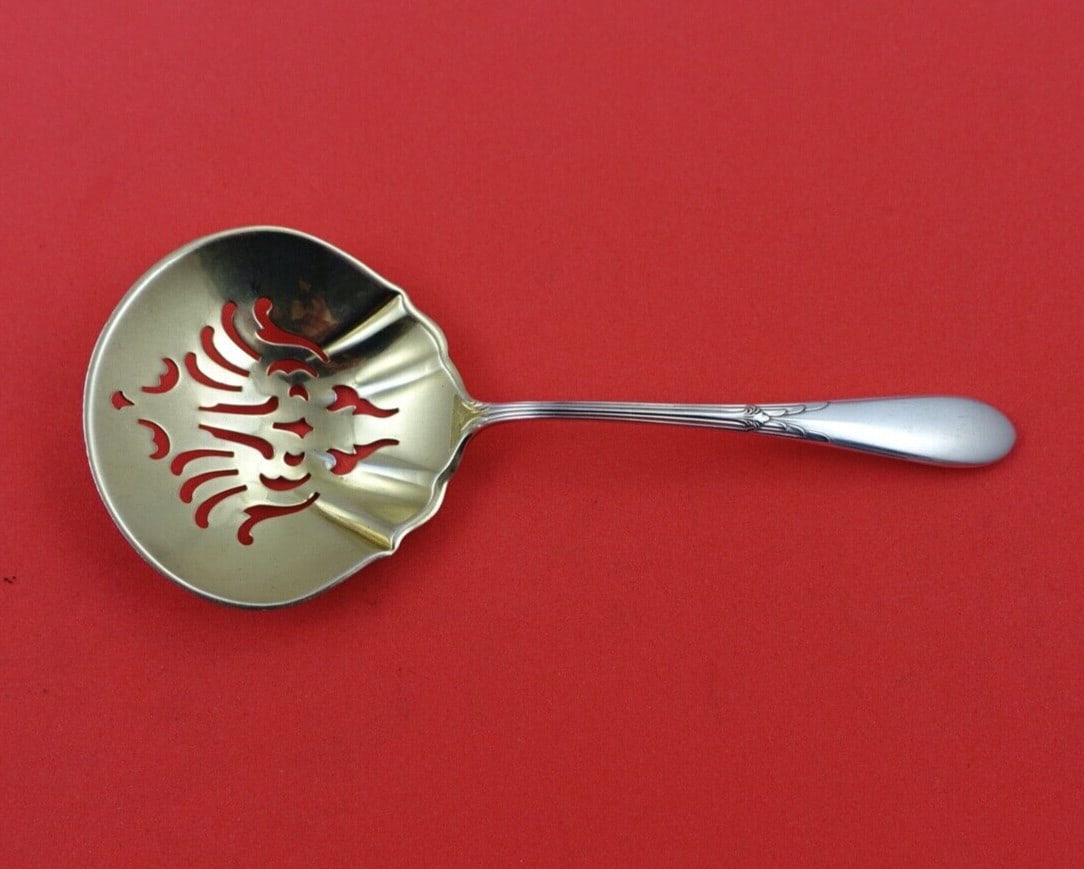 Gorham Rose Marie Sterling Silver Nut Spoon Gold Washed 4 3/4": Gorham Rose Marie Sterling Silver Nut Spoon Gold Washed 4 3/4" This exquisite nut spoon from the Rose Marie pattern by Gorham is crafted from high-quality sterling silver and features a gold wash fini