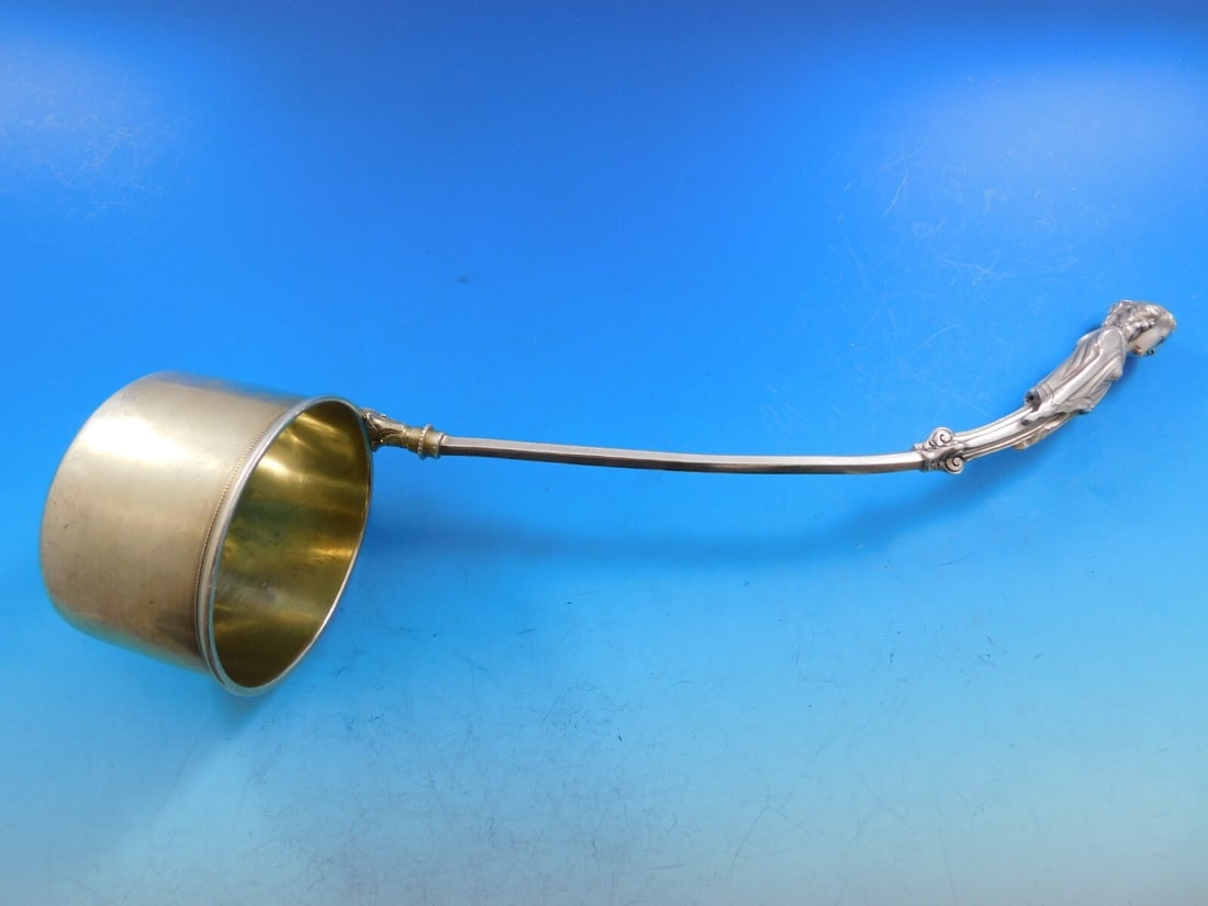 George Sharp Sterling Silver Oyster Ladle Ivy Pattern Gold Wash 11.5": George Sharp Sterling Silver Oyster Ladle Ivy Pattern Gold Wash 11.5" This exquisite George Sharp sterling silver oyster ladle features a gold-washed bucket bowl and a beautifully detailed woman bust 