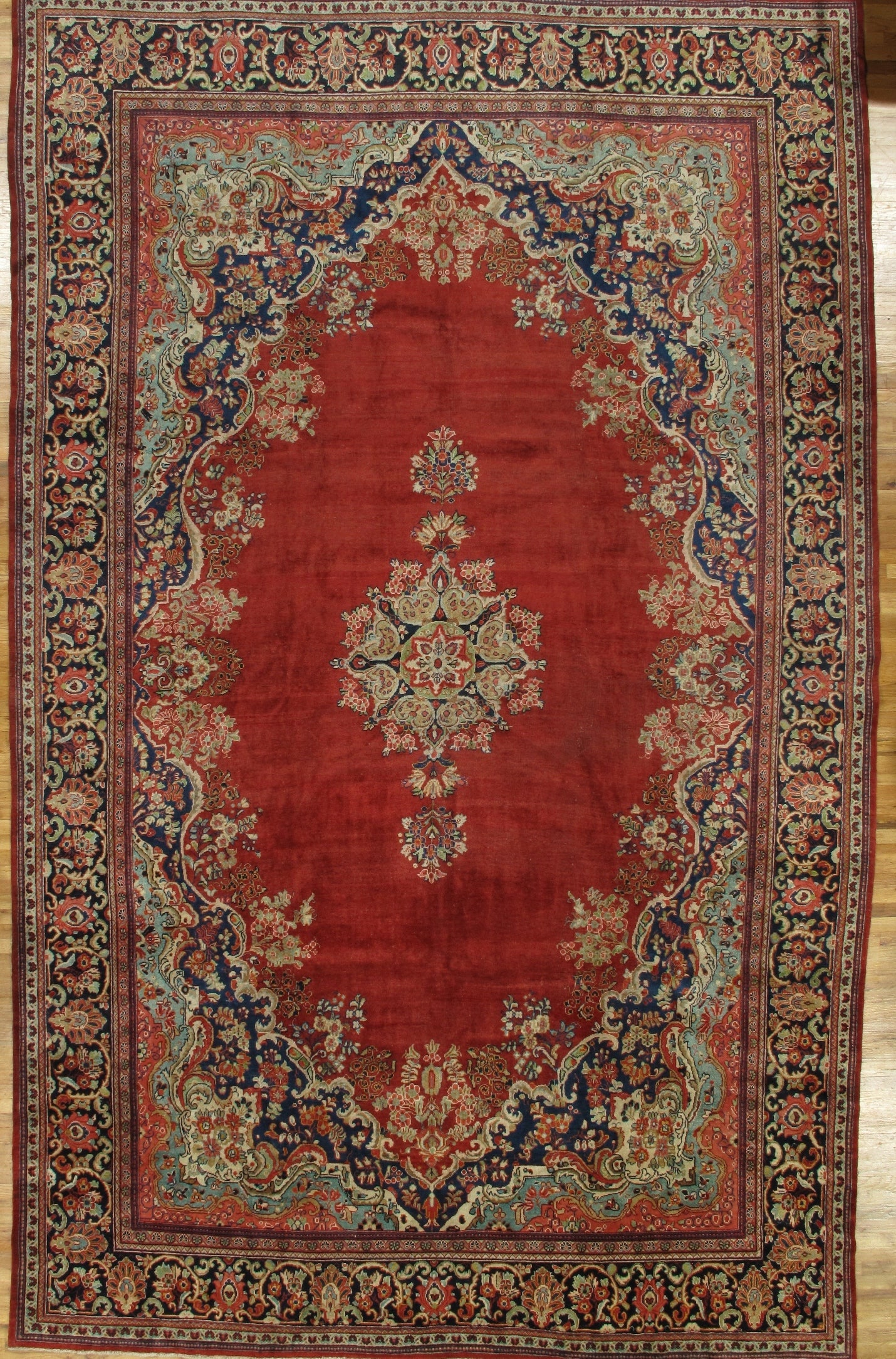 11' x 17.9' Red Antique Persian Sarouk Kerman Hand-Knotted Rug: 11' x 17.9' Red Antique Persian Sarouk Kerman Hand-Knotted Rug Free continental US Shipping Experience the elegance of the 11' x 17.9' Red Antique Persian Sarouk Kerman Rug, a stunning example of trad