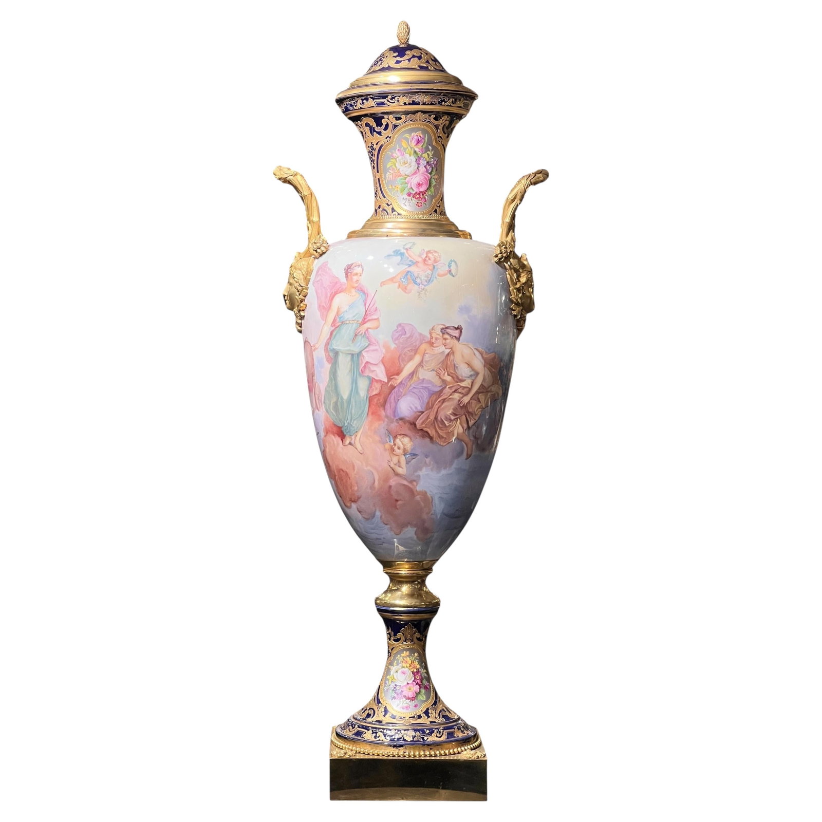 Palace Size Louis XVI Sevres Style Porcelain Vase with Gilt Bronze Mounts: Palace Size Louis XVI Sevres Style Porcelain Vase with Gilt Bronze Mounts This large antique French Sevres style porcelain vase features ornate gilt bronze mounts and a removable cover. Crafted in the