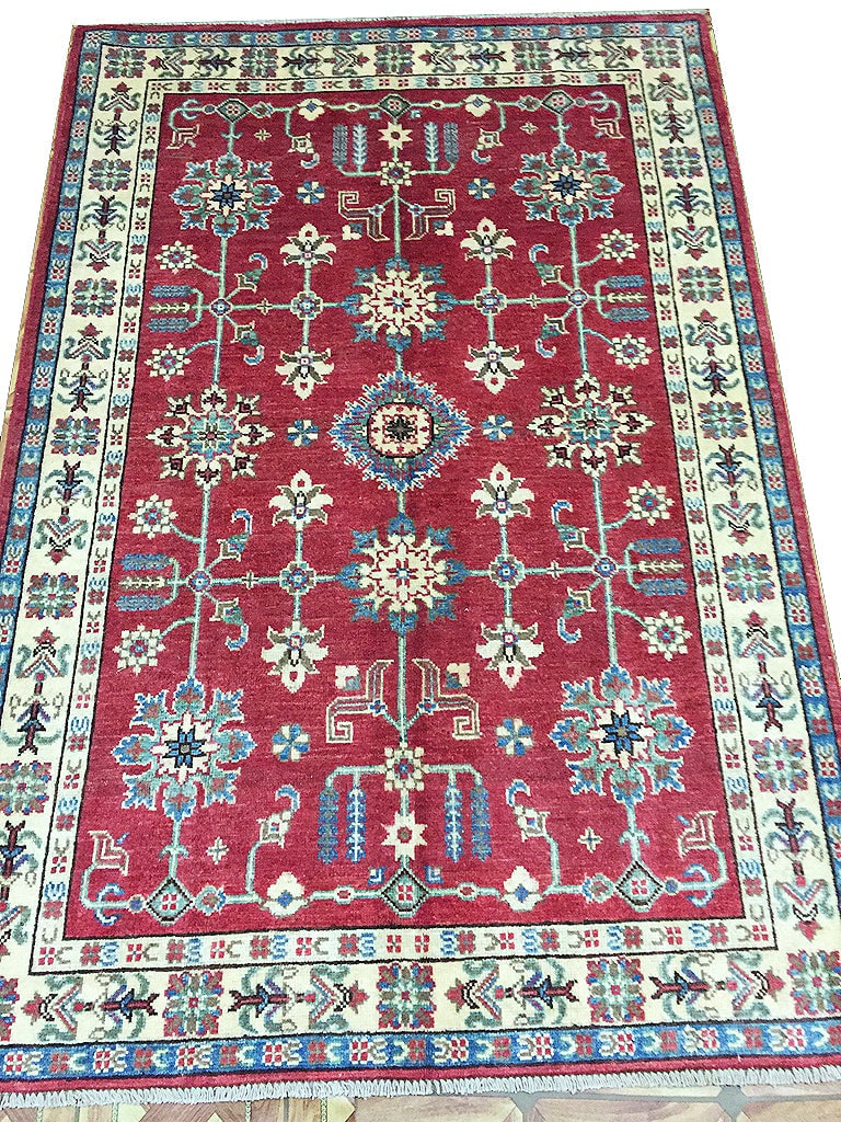 Handmade Kazak Rug 3.11 x 5.9 Feet Wool Area Rug Pakistan: Handmade Kazak Rug 3.11 x 5.9 Feet Wool Area Rug Pakistan Free continental US Shipping Discover the beauty of Pakistani heritage with this Handmade Kazak Rug, measuring 3.11 x 5.9 feet (47 x 69 inches