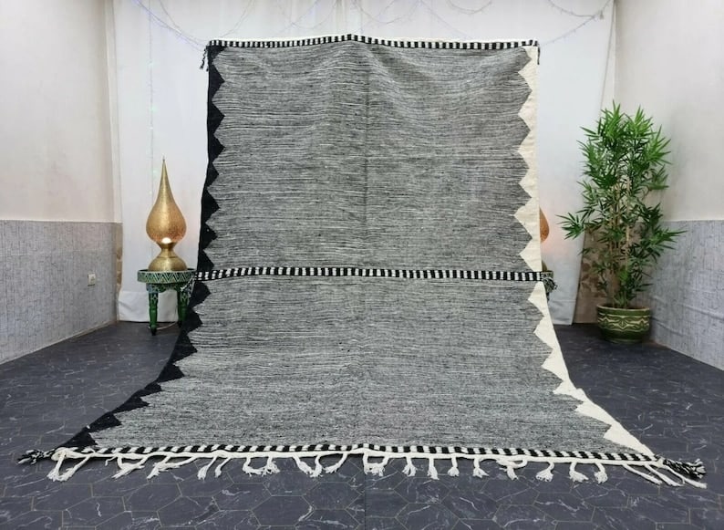 Authentic Handwoven Grey Rug 8 x 5 Feet from Morocco: Authentic Handwoven Grey Rug 8 x 5 Feet from Morocco This authentic Stunning Grey Rug is handwoven in the Atlas Mountains by skilled Berber women weavers. Crafted using traditional tools and natural l
