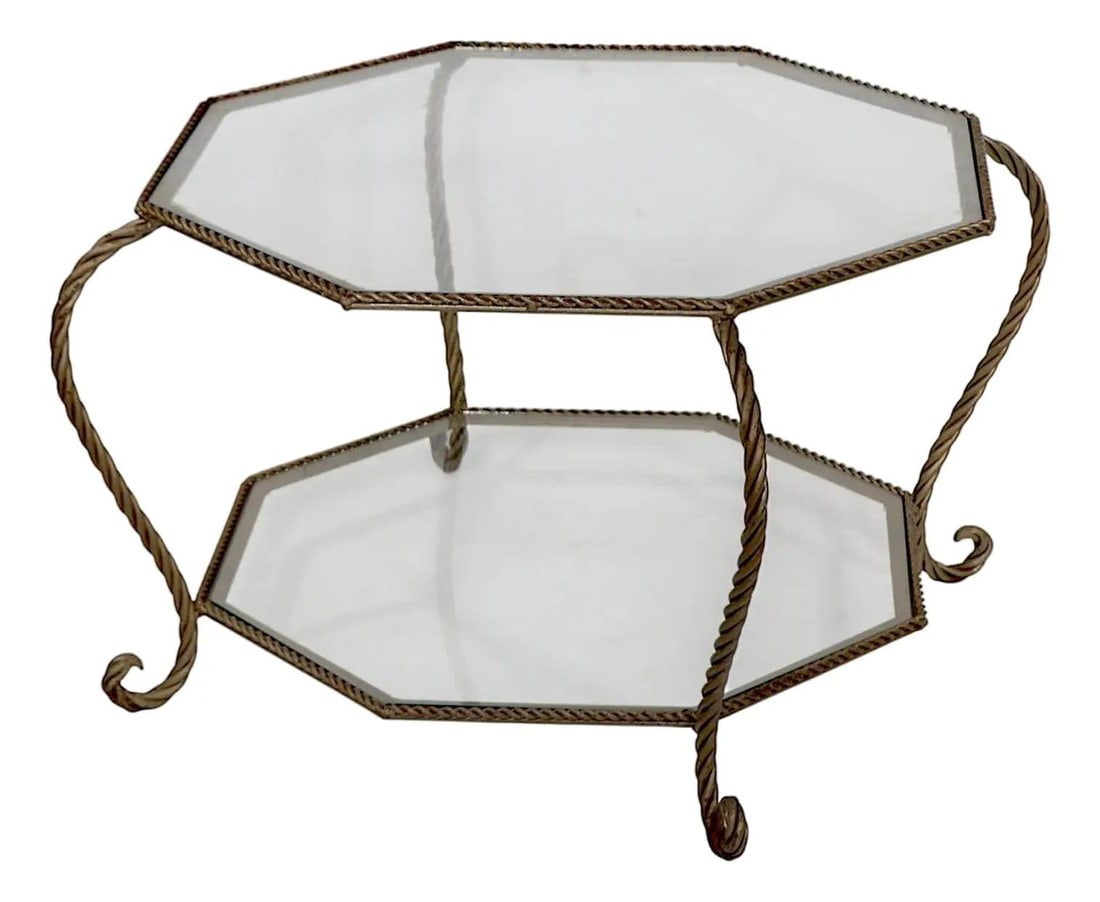Octagonal Two Tier Wrought Iron Glass Coffee Table Gold C. 1950s 1970s: Octagonal Two Tier Wrought Iron Glass Coffee Table Gold C. 1950s 1970s This chic Hollywood Regency style coffee table features an elegant two-tier design, constructed from rope twist wrought iron comp