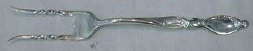 Wallace Silver Swirl sterling baked potato serving fork 7 1/4: Wallace Silver Swirl sterling baked potato serving fork 7 1/4 Custom-made baked potato fork in the Silver Swirl pattern by Wallace, crafted in sterling silver. This post-1940 serving piece is made in 