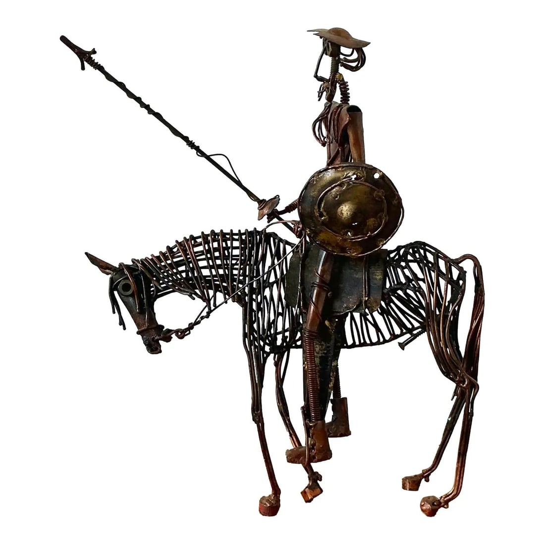 Mid-Century Brutalist Metal Don Quixote Sculpture on Horseback Copper Iron: Mid-Century Brutalist Metal Don Quixote Sculpture on Horseback Copper Iron This vintage Brutalist sculpture depicts Don Quixote de la Mancha, crafted with intricate wire-wrapping and artisanal welding