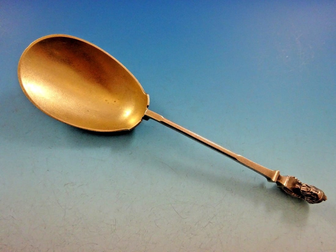 Gorham Bust Sterling Silver Gold Washed Berry Spoon 8 5/8": Gorham Bust Sterling Silver Gold Washed Berry Spoon 8 5/8" This exquisite serving spoon is crafted from sterling silver and features the elegant Bust pattern by Gorham. The spoon is gold washed, addin
