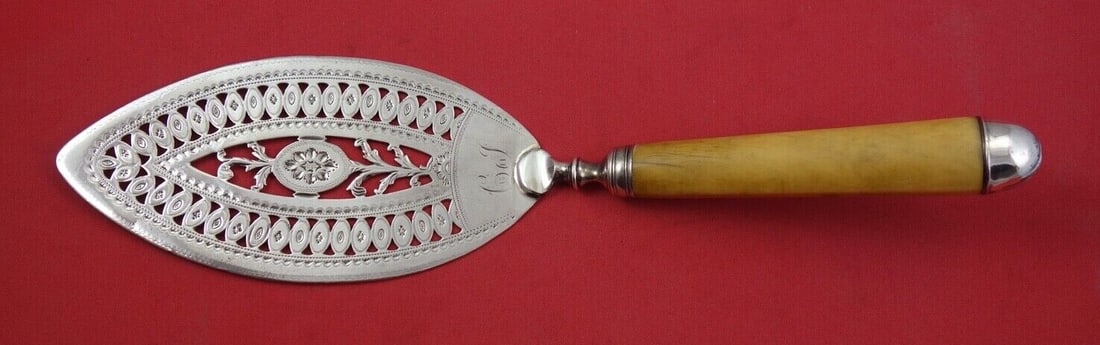 Georgian Sterling Silver Fish Server 11" Engraved Floral Design: Georgian Sterling Silver Fish Server 11" Engraved Floral Design This exquisite English Georgian fish server showcases a stunning design with fancy pierced and engraved floral motifs. Crafted from ster