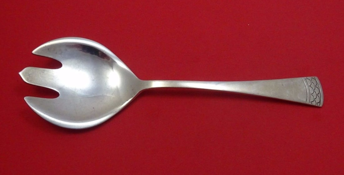 Sterling Silver Salad Serving Fork by Reed and Barton 8 1/4": Sterling Silver Salad Serving Fork by Reed and Barton 8 1/4" A Reed and Barton sterling silver salad serving fork with a decorative handle. The piece is identified as an unusual pattern, which is unkn