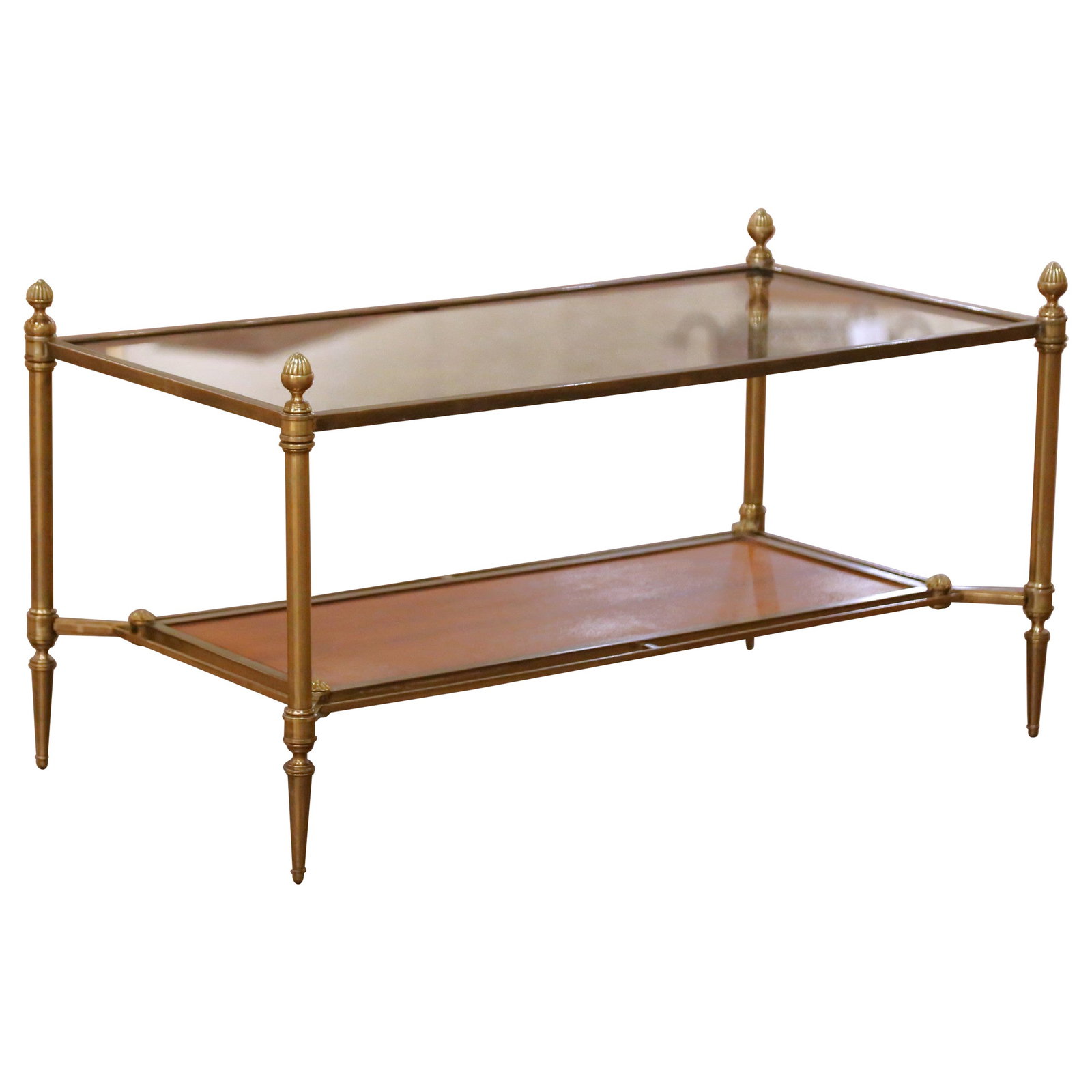 French Directoire Bronze and Leather Coffee Table with Glass Top Circa 1940: French Directoire Bronze and Leather Coffee Table with Glass Top Circa 1940 This elegant two-tier coffee table, crafted by Maison Jansen in France circa 1940, showcases a refined Neoclassical aestheti