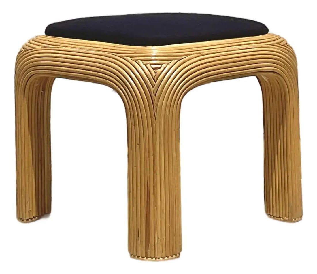 Vintage 1980s Boho Rattan Ottoman with Black Cushion: Vintage 1980s Boho Rattan Ottoman with Black Cushion Elevate your living space with this Vintage Boho Pencil Reed Ottoman, a striking embodiment of 1980s design. Its iconic waterfall corner showcases 