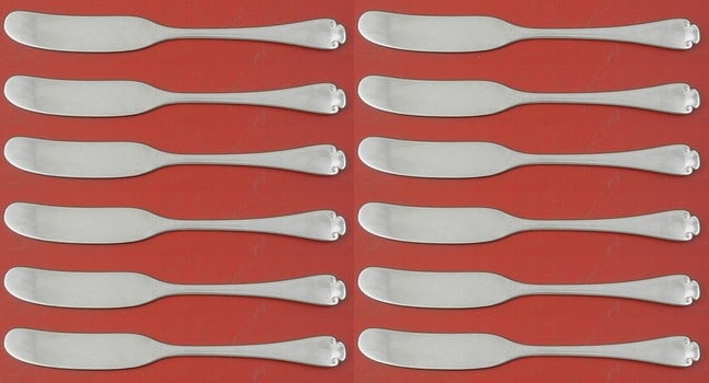 Tiffany & Co Flemish Sterling Silver Butter Spreader Set of 12: Tiffany & Co Flemish Sterling Silver Butter Spreader Set of 12 Enhance your dining experience with this exquisite set of 12 butter spreaders from Tiffany & Co., crafted in the elegant Flemish pattern.