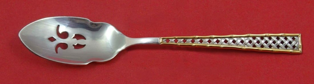International Sterling Silver Golden Tradewinds Pierced Olive Spoon 5 3/4: International Sterling Silver Golden Tradewinds Pierced Olive Spoon 5 3/4 This exquisite serving spoon features the elegant Golden Tradewinds pattern by International Sterling. Crafted from high-quali