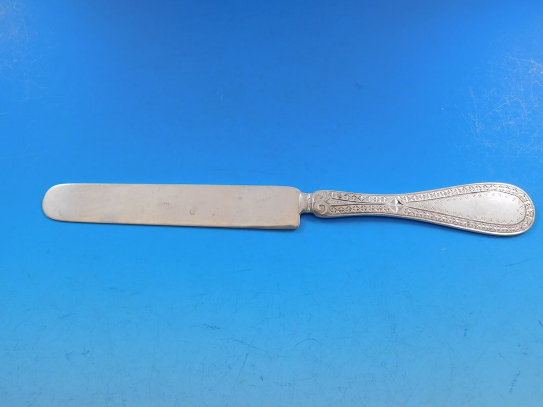 Shreve & Co Brite-Cut Sterling Silver Dessert Knife 7 Inch: Shreve & Co Brite-Cut Sterling Silver Dessert Knife 7 Inch This exquisite Brite-Cut dessert knife by Shreve & Co. showcases a stunning flat handle design crafted from all-sterling silver. Measuring 7 