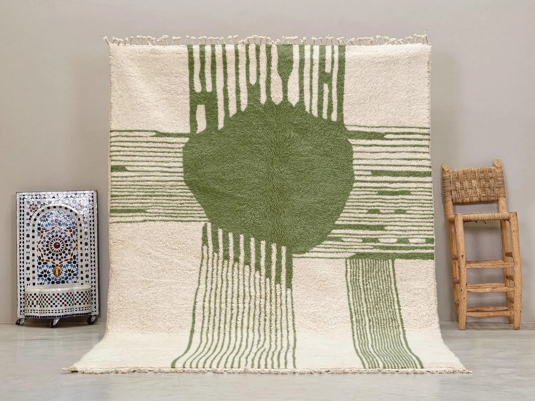 Moroccan Berber Wool Rug in Green and Ivory 1.5 x 2.5 meters: Moroccan Berber Wool Rug in Green and Ivory 1.5 x 2.5 meters This handmade Berber wool rug brings together traditional Moroccan craftsmanship and bold contemporary design. Expertly woven by Berber wom