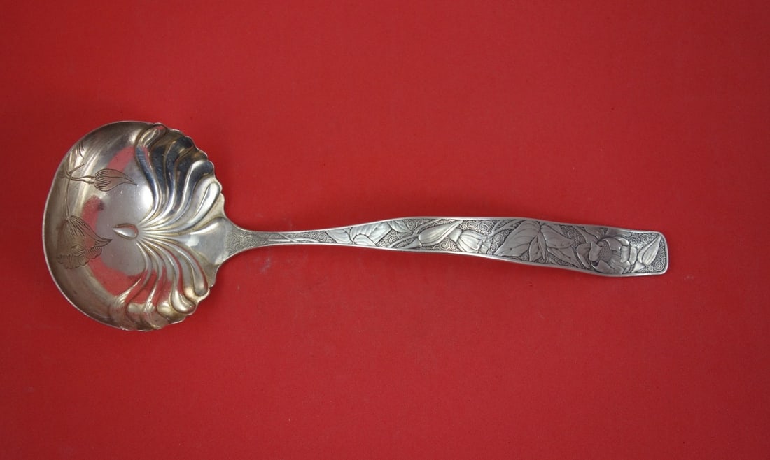 Towle Orchids Sterling Silver Oyster Ladle 10 1/2 inch: Towle Orchids Sterling Silver Oyster Ladle 10 1/2 inch This is a sterling silver oyster ladle in the Orchids pattern by Towle. The ladle features a brite-cut finish with an orchid motif in the bowl. I