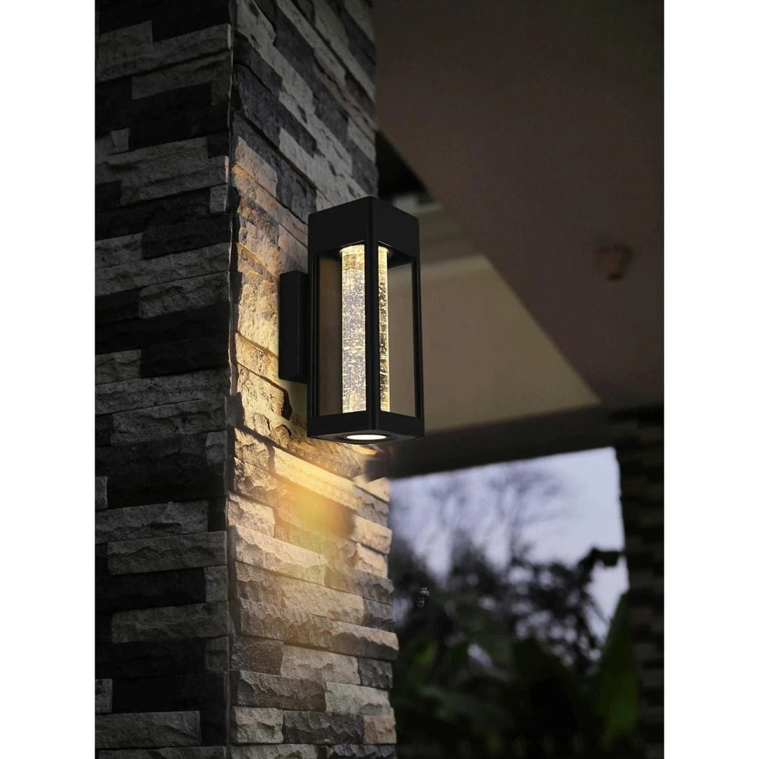 Amaris black outdoor wall light seedy glass LED 9.9 inch: Amaris black outdoor wall light seedy glass LED 9.9 inch This outdoor wall sconce features a sleek black metal frame with a clear seedy glass cylinder, offering a modern and sophisticated look for pat