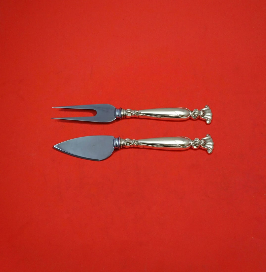 Wallace Romance of the Sea Sterling Silver Cheese Serving Set: Wallace Romance of the Sea Sterling Silver Cheese Serving Set Introducing the exquisite Romance of the Sea Sterling Silver Hard Cheese Serving Set by Wallace, a perfect addition to any cheese lover's 