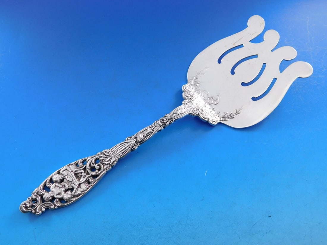 Dominick & Haff Labors of Cupid Sterling Silver Asparagus Fork 9 3/4" Art Nouveau: Dominick & Haff Labors of Cupid Sterling Silver Asparagus Fork 9 3/4" Art Nouveau This exquisite asparagus serving fork by Dominick & Haff is crafted from high-quality sterling silver and features the